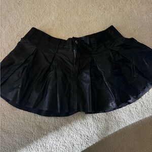 Olivaceous black leather mini skirt